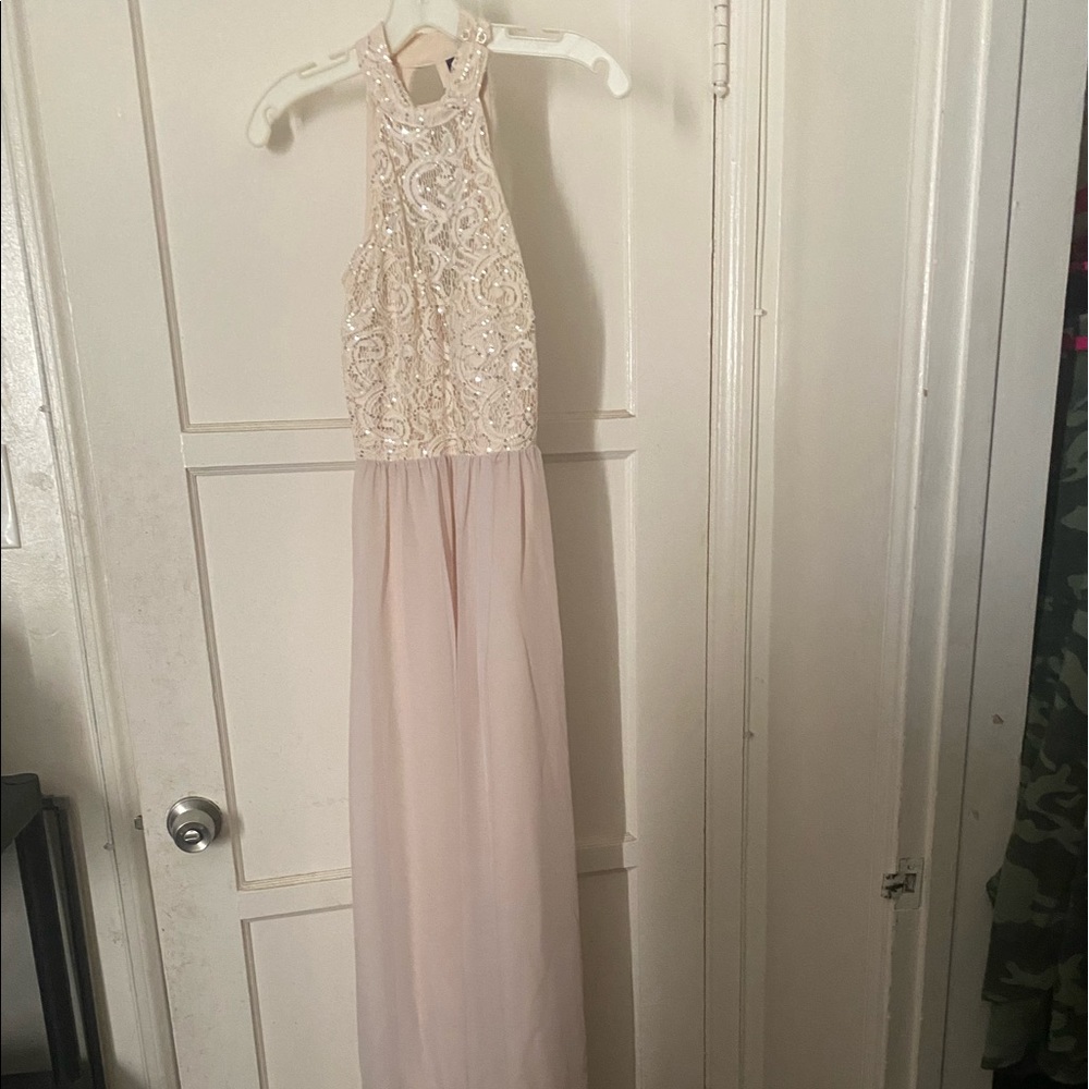 Beautiful floor length beaded gown .